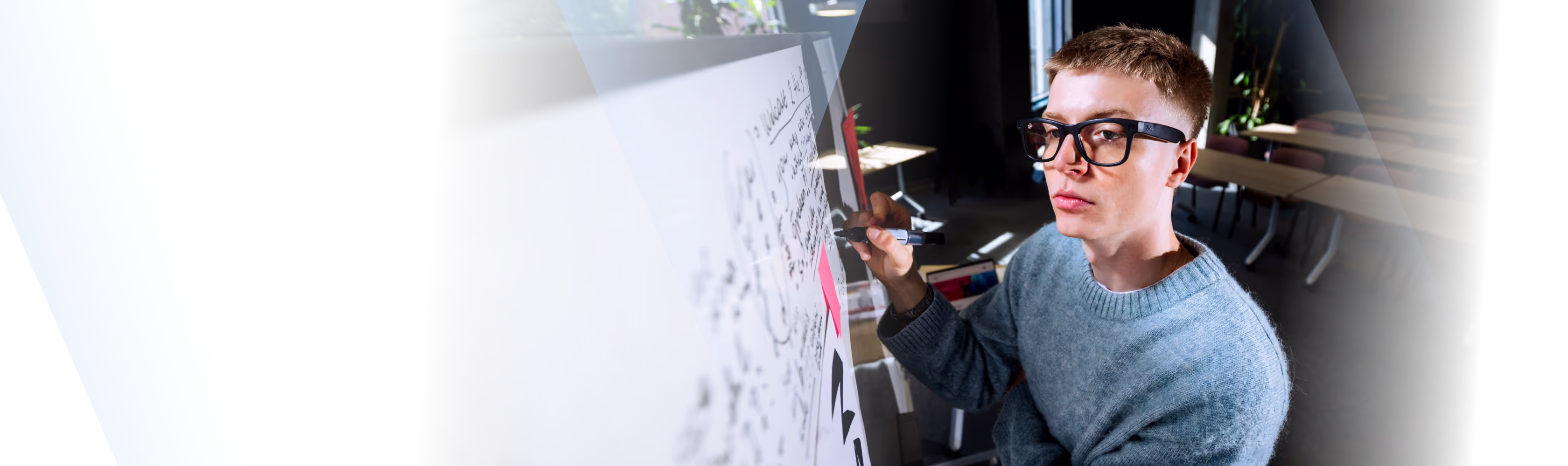 Two students with a laptop and backpacks.